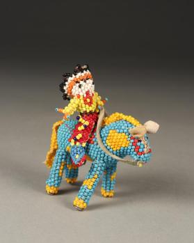 Figure, horse and rider, beaded